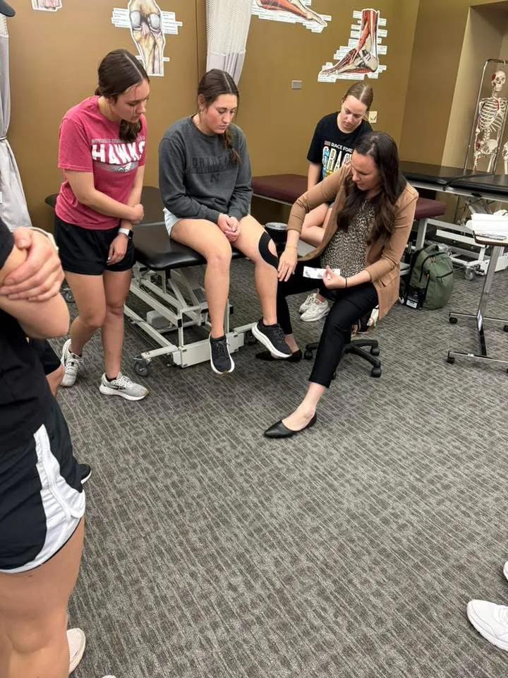 Therapist evaluating a patient's knee
