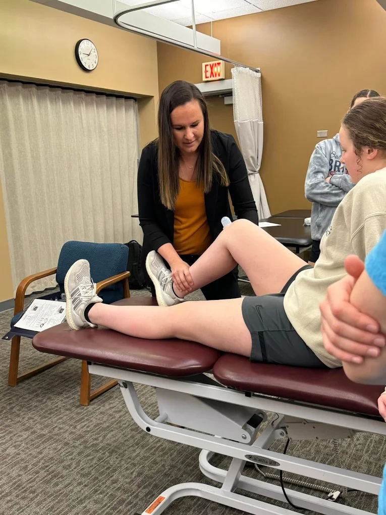 Therapist working with a patient on the treatment table